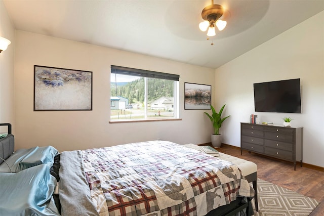 301 Bernie Rd, Alberton, MT 59820 - bedroom with lofted ceiling, wood finished floors, a ceiling fan, and baseboards