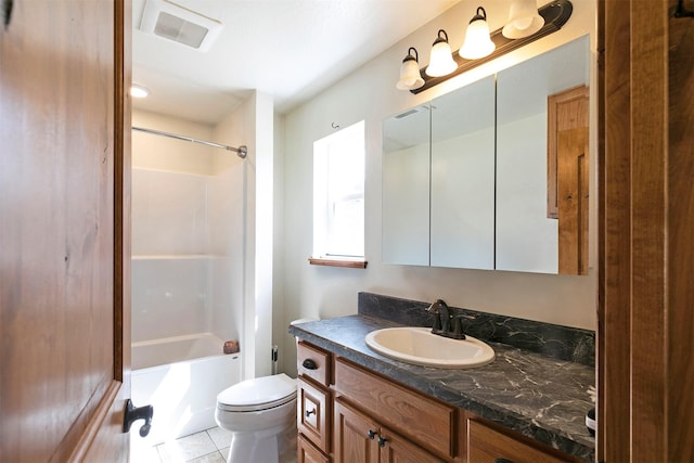 301 Bernie Rd, Alberton, MT 59820 - bathroom with toilet, vanity, tub / shower combination, and tile patterned floors