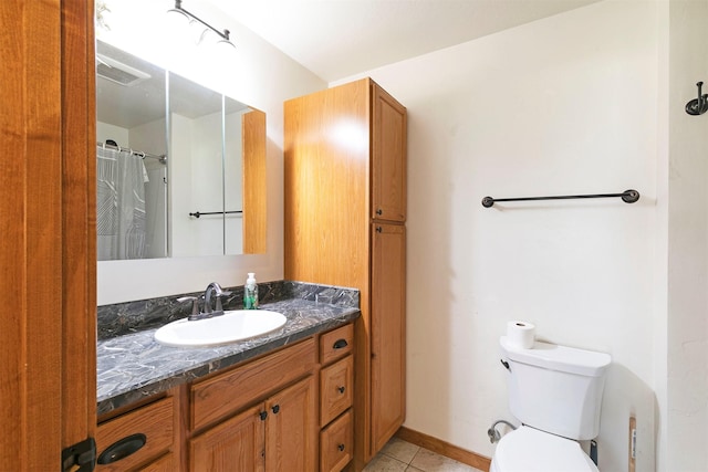 301 Bernie Rd, Alberton, MT 59820 - bathroom featuring tile patterned flooring, toilet, vanity, and baseboards