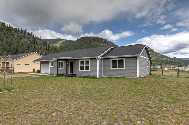 301 Bernie Rd, Alberton, MT 59820 - view of front facade featuring a mountain view, a garage, and a shingled roof