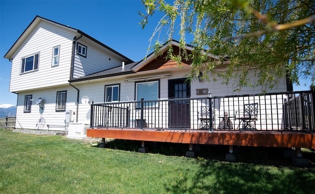 4714 Linhart Ln, Stevensville, MT 59870 - back of house featuring a lawn and a wooden deck