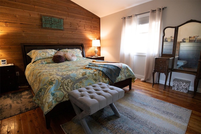 4714 Linhart Ln, Stevensville, MT 59870 - bedroom featuring vaulted ceiling, wood finished floors, and wooden walls