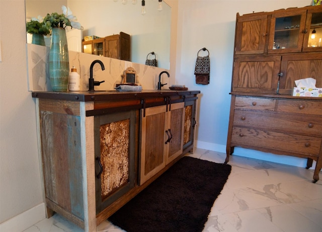 4714 Linhart Ln, Stevensville, MT 59870 - bathroom featuring marble finish floors, baseboards, and a sink