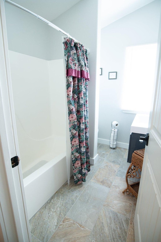 4714 Linhart Ln, Stevensville, MT 59870 - full bath featuring vanity, baseboards, and shower / bath combo