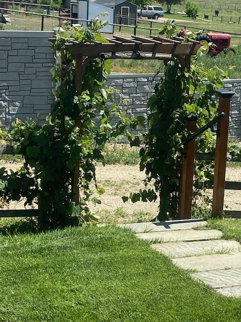 4714 Linhart Ln, Stevensville, MT 59870 - view of green lawn with a storage unit and an outdoor structure