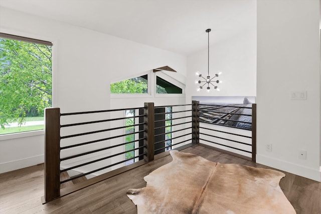 135 Sapphire Ct, Whitefish, MT 59937 - stairs featuring baseboards, wood finished floors, and a chandelier