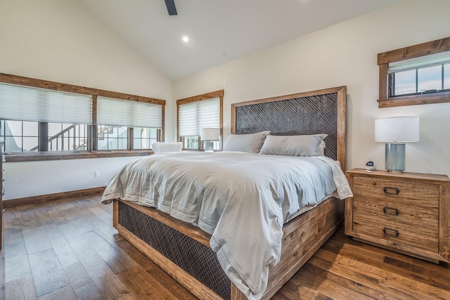 bedroom with dark wood finished floors, high vaulted ceiling, recessed lighting, baseboards, and ceiling fan