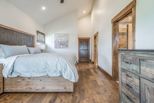 bedroom with high vaulted ceiling, dark wood finished floors, baseboards, and recessed lighting