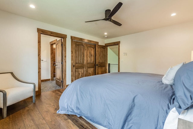 bedroom featuring wood finished floors, recessed lighting, ceiling fan, connected bathroom, and baseboards