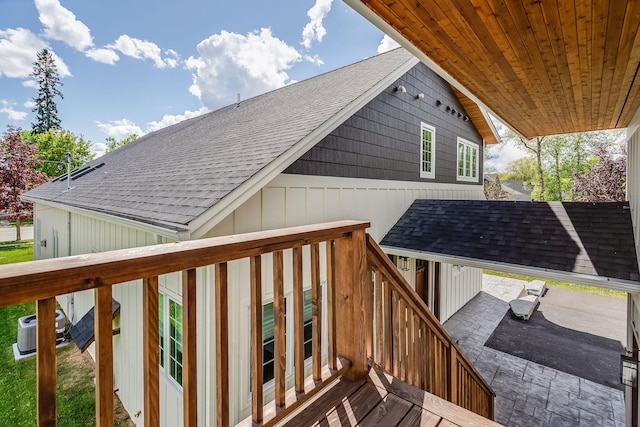 wooden deck with central air condition unit