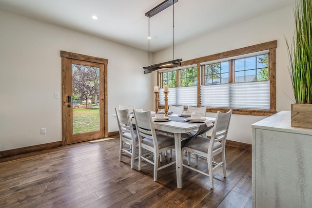 dining space featuring dark wood-style floors, baseboards, and recessed lighting