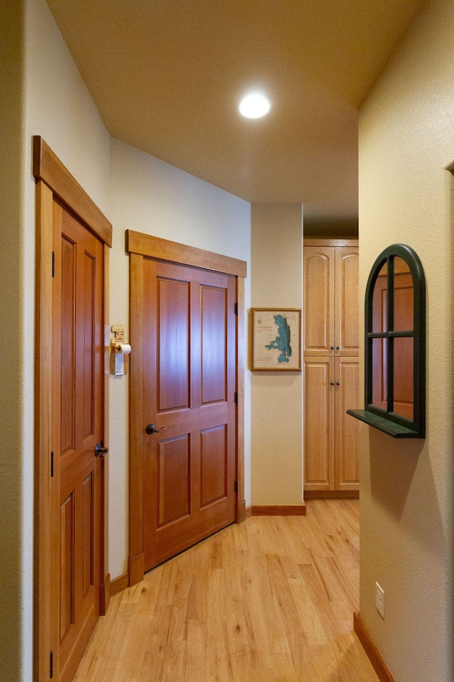 34520 Rocky Point Rd, Polson, MT 59860 - hallway with light wood-type flooring, baseboards, and recessed lighting