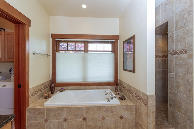 34520 Rocky Point Rd, Polson, MT 59860 - full bathroom with a garden tub and washer / dryer