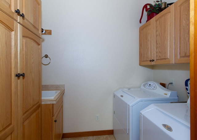 34520 Rocky Point Rd, Polson, MT 59860 - washroom featuring cabinet space, washing machine and dryer, and baseboards