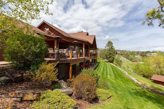 34520 Rocky Point Rd, Polson, MT 59860 - back of property with a lawn and a wooden deck