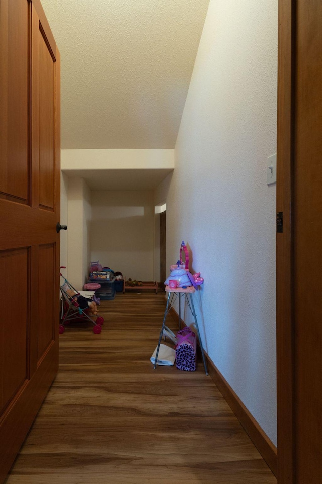34520 Rocky Point Rd, Polson, MT 59860 - corridor featuring baseboards, light wood-style floors, and vaulted ceiling