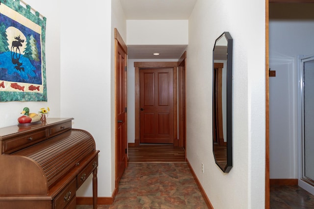 34520 Rocky Point Rd, Polson, MT 59860 - corridor with stone finish flooring, baseboards, arched walkways, and recessed lighting