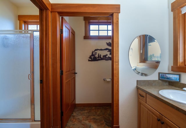34520 Rocky Point Rd, Polson, MT 59860 - bathroom featuring vanity, a stall shower, and baseboards