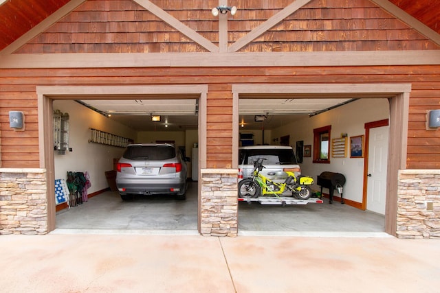 34520 Rocky Point Rd, Polson, MT 59860 - garage with driveway and a garage door opener
