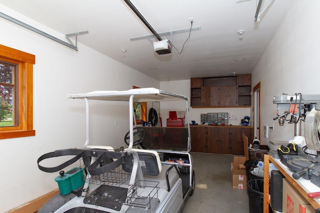 34520 Rocky Point Rd, Polson, MT 59860 - garage featuring a garage door opener and a workshop area
