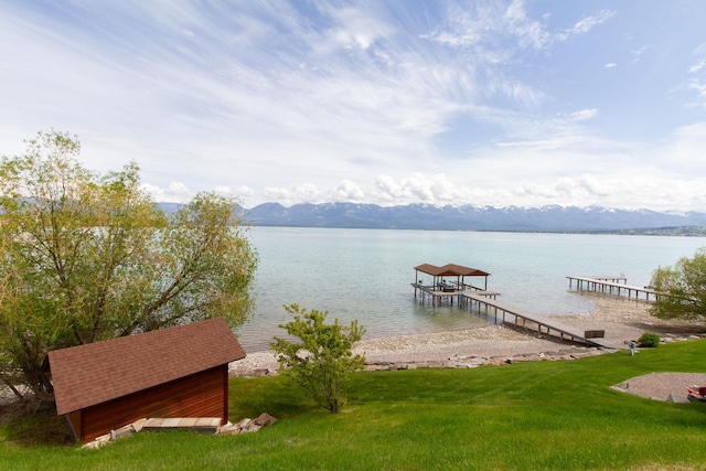 34520 Rocky Point Rd, Polson, MT 59860 - dock area featuring a water and mountain view and a lawn