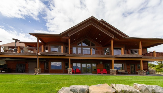 34520 Rocky Point Rd, Polson, MT 59860 - back of property with a balcony, a yard, and a patio area