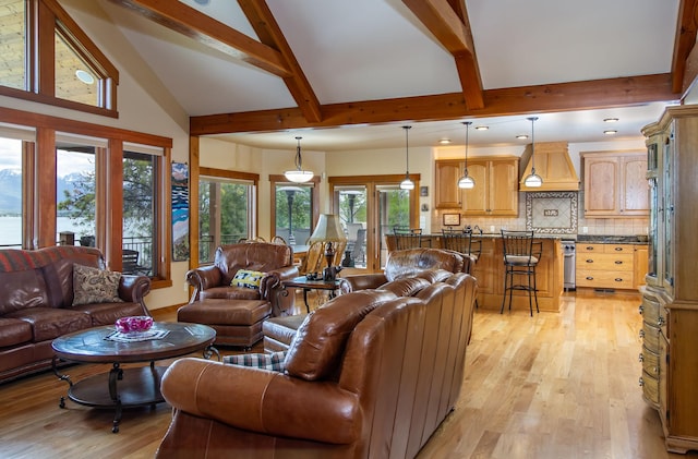 34520 Rocky Point Rd, Polson, MT 59860 - living area featuring beamed ceiling, light wood-style flooring, and high vaulted ceiling