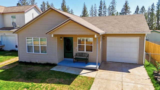 35881 Warbler Dr, Ronan, MT 59864 - view of front of property featuring a garage, driveway, and a porch