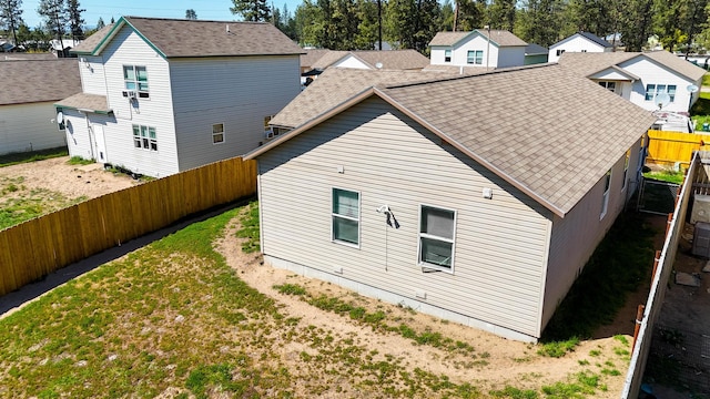 35881 Warbler Dr, Ronan, MT 59864 - rear view of property with fence, roof with shingles, and a residential view