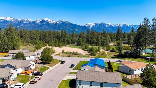 35881 Warbler Dr, Ronan, MT 59864 - aerial perspective of suburban area with mountains and a forest