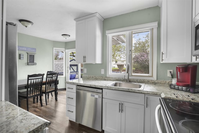 501 23rd Ave NE, Great Falls, MT 59404 - kitchen with appliances with stainless steel finishes, a sink, dark wood finished floors, and white cabinets
