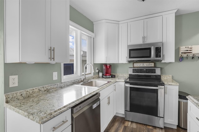 501 23rd Ave NE, Great Falls, MT 59404 - kitchen with stainless steel appliances, a sink, and white cabinets