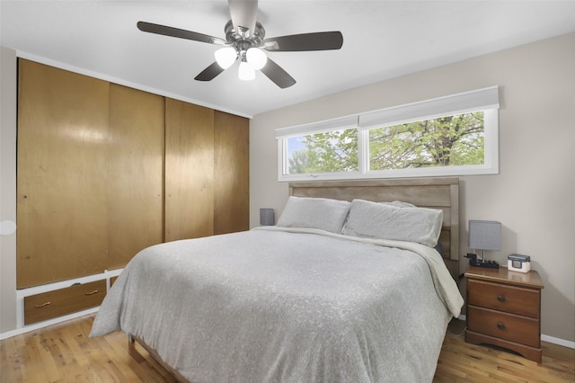 501 23rd Ave NE, Great Falls, MT 59404 - bedroom featuring wood finished floors, a closet, baseboards, and ceiling fan