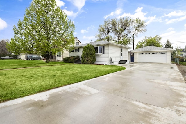 501 23rd Ave NE, Great Falls, MT 59404 - view of front of home featuring a garage, a front lawn, an outdoor structure, and entry steps