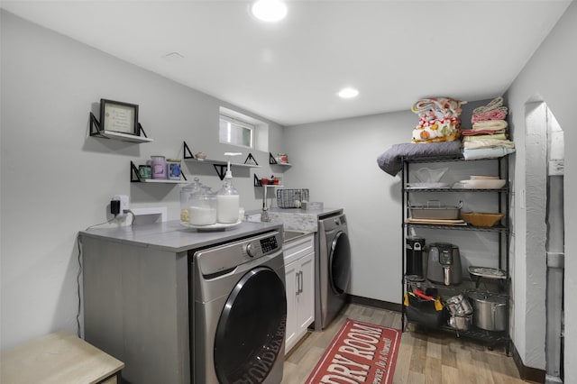 501 23rd Ave NE, Great Falls, MT 59404 - laundry area with washer / clothes dryer, light wood-type flooring, cabinet space, and recessed lighting