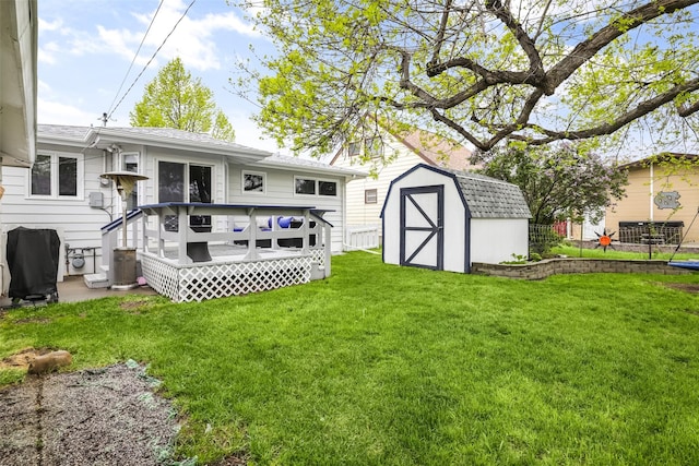 501 23rd Ave NE, Great Falls, MT 59404 - back of house featuring a deck, a storage unit, an outbuilding, and a yard