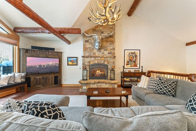 living room featuring a chandelier, beam ceiling, a stone fireplace, wood finished floors, and high vaulted ceiling