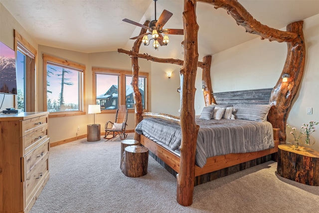bedroom with carpet, vaulted ceiling, and baseboards