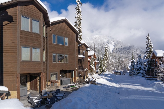 snow covered building with a mountain view