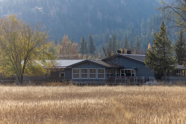 3690 Big Flat Rd, Missoula, MT 59804 - rear view of property featuring a view of trees and metal roof