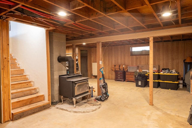 3690 Big Flat Rd, Missoula, MT 59804 - below grade area with a wood stove and stairway