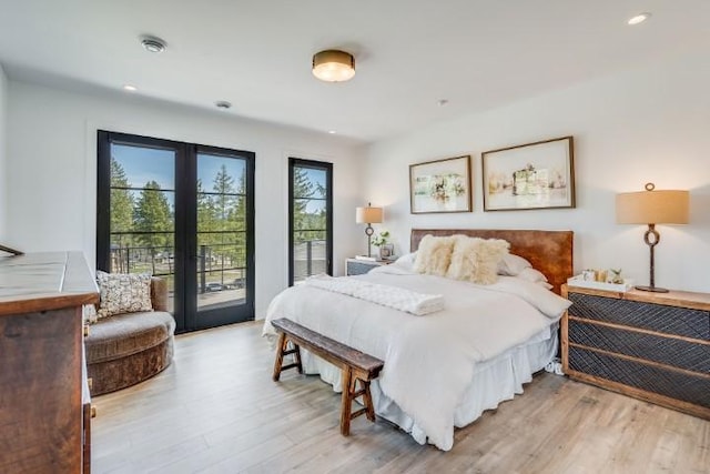 111 Blacktail Loop, Lakeside, MT 59922 - bedroom featuring french doors, light wood-type flooring, access to outside, and recessed lighting