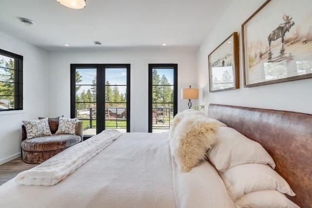 111 Blacktail Loop, Lakeside, MT 59922 - bedroom with wood finished floors and recessed lighting