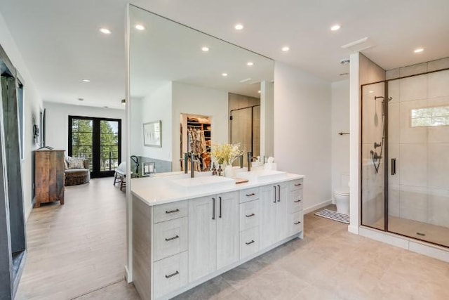 111 Blacktail Loop, Lakeside, MT 59922 - bathroom featuring double vanity, a stall shower, and recessed lighting