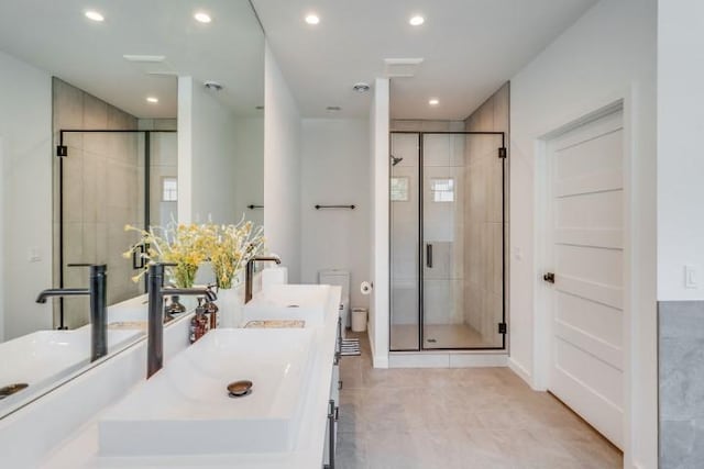 111 Blacktail Loop, Lakeside, MT 59922 - full bath featuring a stall shower, double vanity, and recessed lighting
