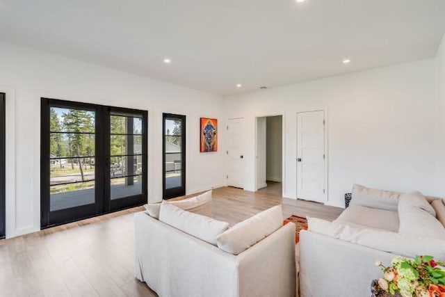 111 Blacktail Loop, Lakeside, MT 59922 - living area featuring light wood-style flooring, recessed lighting, and french doors