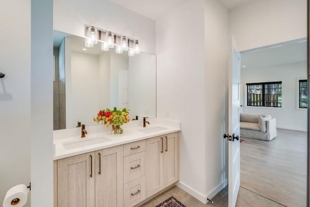 111 Blacktail Loop, Lakeside, MT 59922 - ensuite bathroom featuring double vanity and wood finished floors