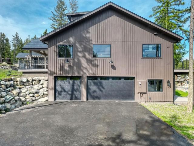 111 Blacktail Loop, Lakeside, MT 59922 - view of property exterior featuring a garage and driveway