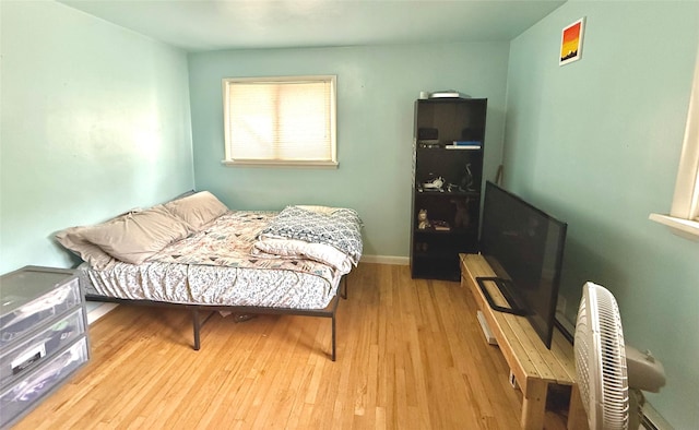 bedroom with wood finished floors