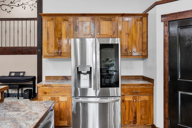 440 E 20th St, Hamilton, MT 59840 - kitchen featuring stainless steel refrigerator with ice dispenser and brown cabinetry